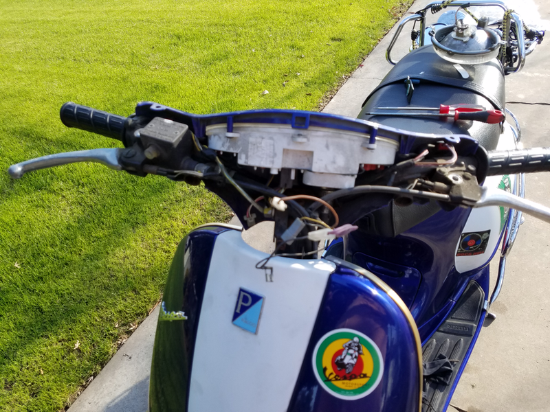 Handlebar cover open and old unit out.